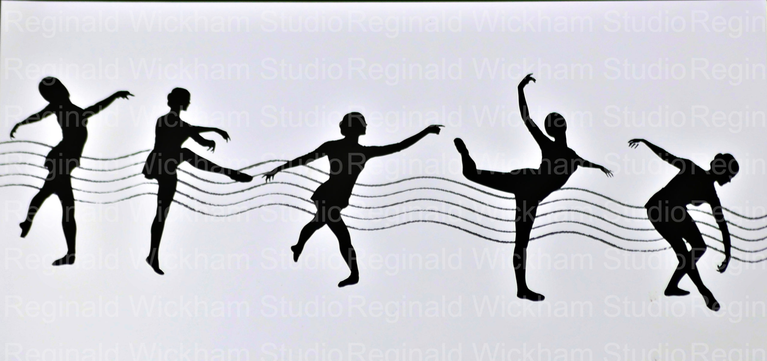 Silhouetted dancers on a musical staff
