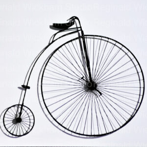 Black and white photography art of an old style bicycle with huge front wheel