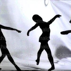 landscape silhouette photo of three girls dancers in front of flowing white sheet backdrop