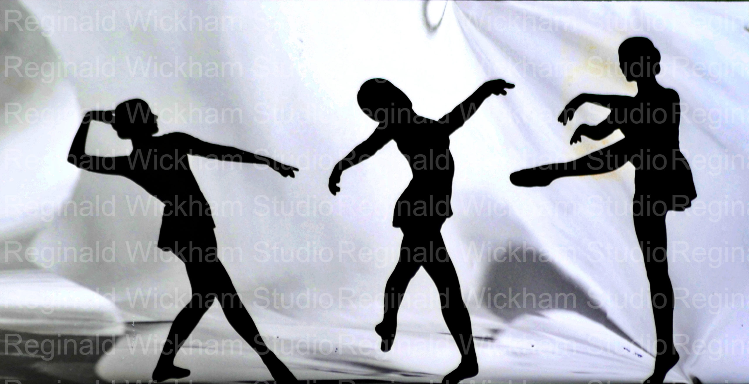 landscape silhouette photo of three girls dancers in front of flowing white sheet backdrop