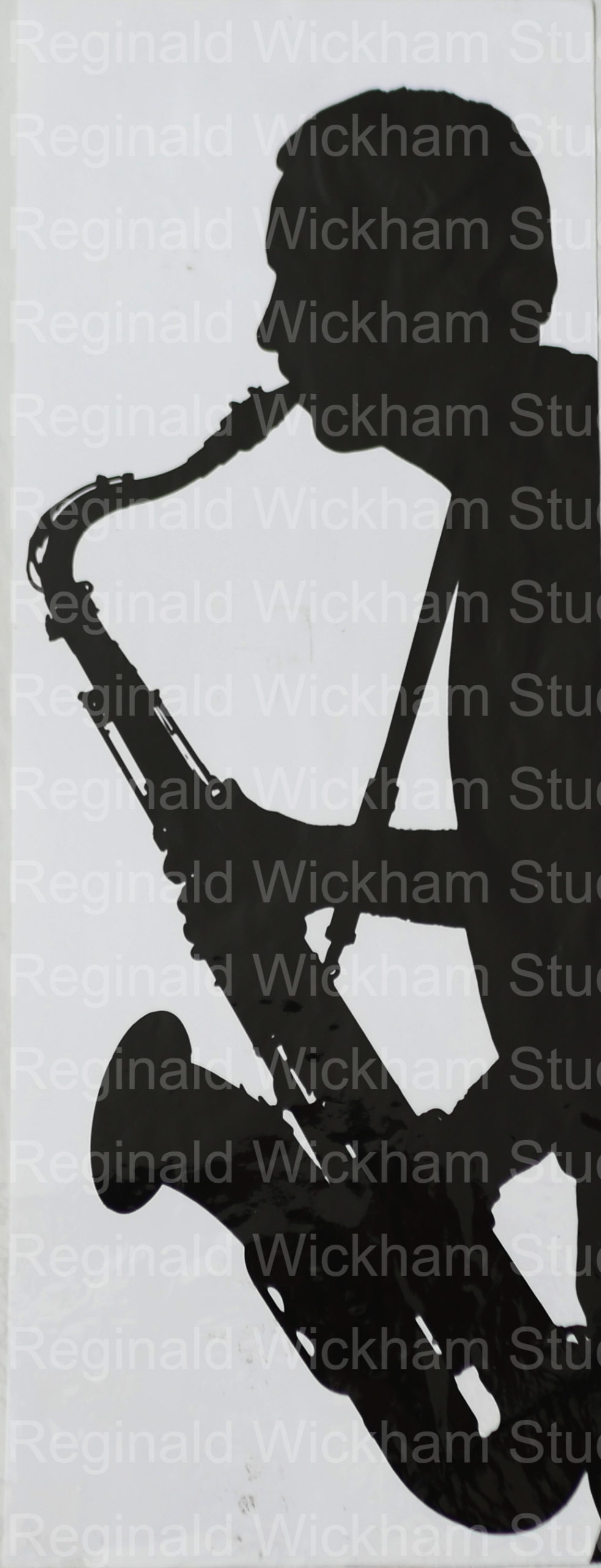 Silhouetted man playing the saxophone