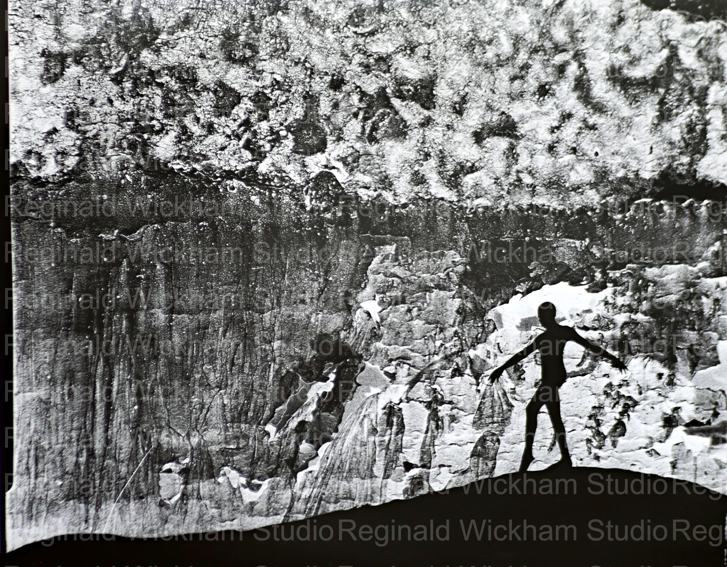 Silhouetted photograph of dancer in front of mountain in black and white